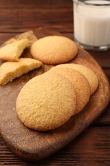 Fototapeta na wymiar Delicious Danish butter cookies on wooden table, closeup