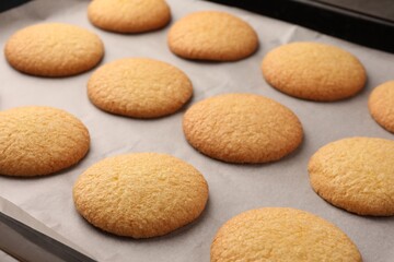 Delicious Danish butter cookies on baking tray, closeup