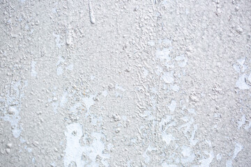Texture of paint stains on the wall, cracked paint on an old metal surface. Sheet of silver metal...