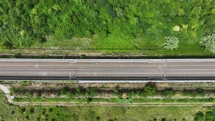 Zenith view: aerial image of a section of the empty high-speed HS railroad between Pama and Reggio...