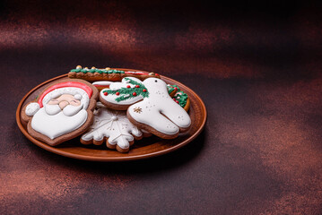 Beautiful delicious Christmas gingerbread on a concrete texture background