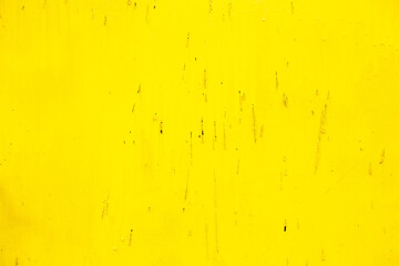 Rusty yellow metal abstract background. Texture of an old plate with dripping stained cracked paint