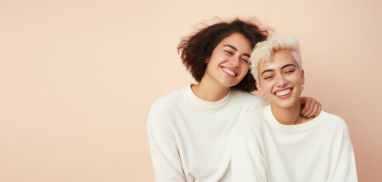 Two young beautiful girls hugging, laughing and smiling against a flat pastel beige background. Happy women girlfriends, portrait, copy space for text. Generative AI photo.