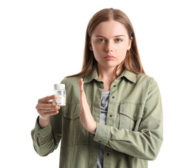 Young female junkie rejecting drugs on white background