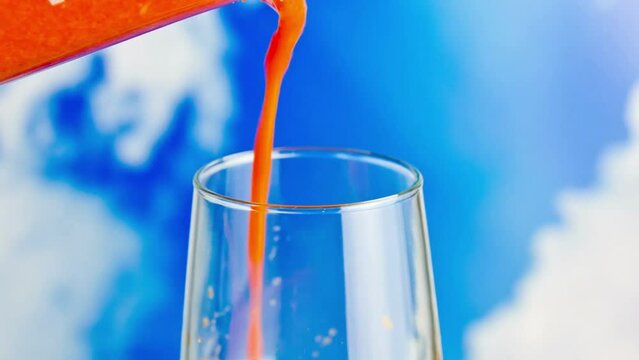 Refreshing Nectar: Close-Up of Freshly Blended Fruit Juice Pouring into a Glass, Rendered in Crisp 4K Resolution