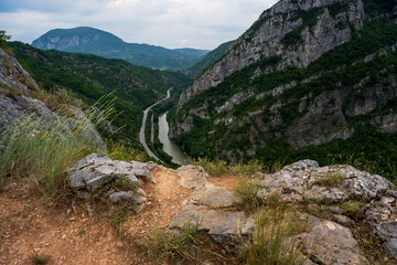 Amazing view from the top of the mountain on the Sicevac Gorge near the town of Nis, Balkan Mountains, Serbia. A beautiful winding road passes through the gorge of the river Nisava.