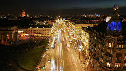 Aerial view of the Nevski street and Kazan Cathedral next to House of the Singer company in the historical and at same time modern city of St. Petersburg at clear night, cold