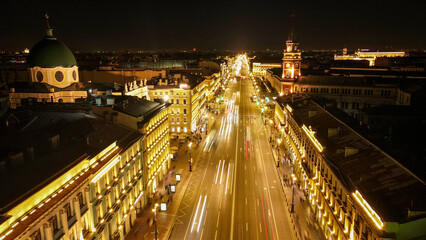 Fototapeta na wymiar Aerial view of the Nevski street and Kazan Cathedral next to House of the Singer company in the historical and at same time modern city of St. Petersburg at clear night, warm color