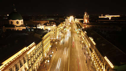 Fototapeta na wymiar Aerial view of the Nevski street and Kazan Cathedral next to House of the Singer company in the historical and at same time modern city of St. Petersburg at clear night, cold color