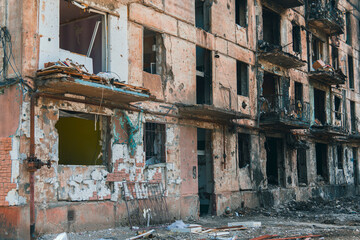Fototapeta na wymiar Residential building destroyed by rocket attack. War in Ukraine. Terror of the civilian population