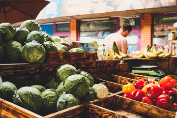 In the foreground cabbage and pepper, open-air fruit and vegetable market - 620158224