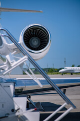 Turbofan engine in focus with out-of-focus stairs.