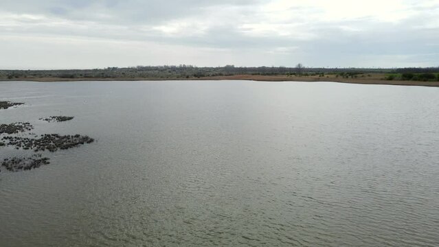 Aerial view coastal dune lake over the water