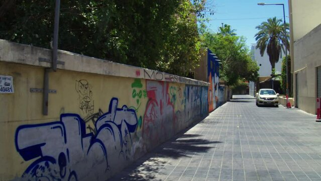 Grafitti on wall in alley in Block 338 neighborhood of Adliya
