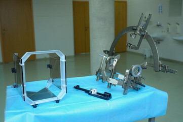 Surgical equipment for implantation of a neurostimulator placed on table. It is used for deep brain...