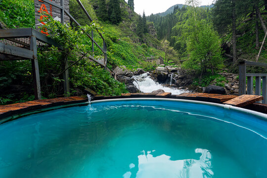 Hot springs geothermal water in mountains. Vat with hot geothermal water in Medeo gorge, hot spring , Almaty, Kazakhstan.