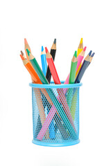 Colored pencils in a blue round stand isolated on a white background.