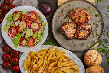 Tenderloin steak and fries with salad