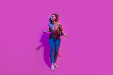Full body photo of millennial lady dancing hip hop on night club isolated bright neon colorful background