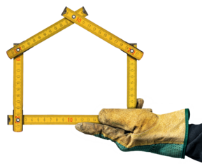 Close-up of a hand with work glove holding a folding ruler in the shape of a house, isolated on white or transparent background. Construction industry concept. Png.