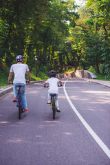 Dad and son cycling