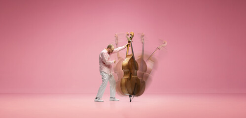 Creative collage. Talented, emotional young man with stylish moustaches playing double bass against...