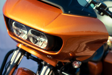 Obraz na płótnie Canvas Detail of the headlight of a modern motorcycle. Close-up.