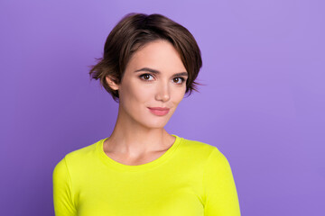 Portrait photo of young nice charming lady posing model wear yellow shirt satisfied vogue magazine isolated on violet color background