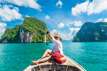 Traveler woman on boat with camera joy nature scenic landscape Lao Lading island Krabi, Attraction famous place tourist travel Phuket Thailand summer holiday vacation trip, Beautiful destination Asia