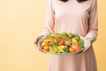 Large plate of fresh healthy vegetable salad in women's hands isolated on pastel orange flat background with copy space. Healthy food delivery banner template. Generative AI photo.