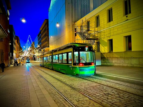 Tram at Night in the City of Helsinki in Finland during the Christmas season Winter in Europe European Transport nightlife metro and tramway nordic city life, suomi, norsk, svenska, dansk