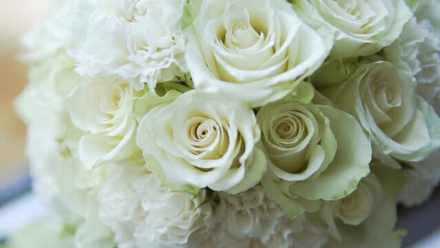 Large bouquet of white roses. A gift for a beloved woman. Sign of attention from the Beloved. Valentine's Day. Bridal bouquet.