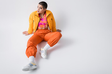 high angle view, fashion statement, outerwear, young woman in casual attire, model with short hair...