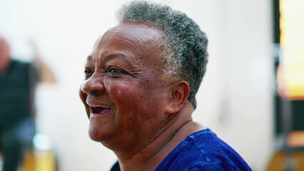 Happy senior woman laughing and smiling, close-up face of a black Brazilian older person, joyful expression of elderly lady