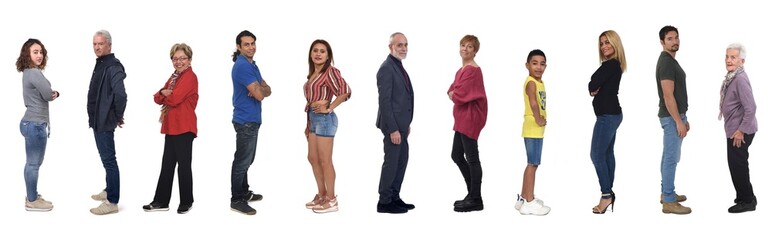 Obraz premium side view of a large group of woman and men looking at camera on whilte background