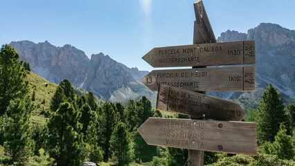 Signs leading the way for hiking in the Geisler mountain range in the Dolomites (Italian Alps)