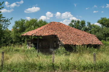 Fototapeta na wymiar Old rural farm barn in summer day