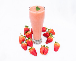 Strawberry juice, pink color, tall transparent glass, surrounded by strawberries, white background, natural fruit, delicious flavor.