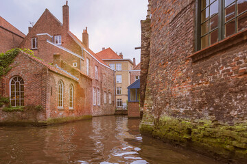 Bruges, Belgium. Historic center of the city. Windows with brick wall of medieval houses on Rozenhoedkaai canal. West Flanders Province, Belgium. Cityscape of Bruges (Brugge).