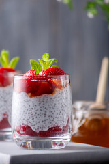Healthy pudding with chia seeds and strawberries with honey. Healthy eating