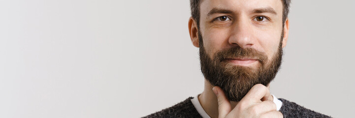 Fototapeta premium White mid man with beard posing and looking at camera