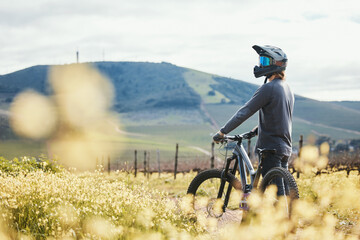 Sports, mockup and man on mountain bike in nature for training, workout and exercise in countryside. Fitness, cycling and male person with bicycle for adventure, freedom and adrenaline on dirt road