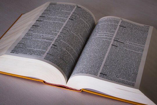 A classic open dictionary of the Italian language seen from above, the concept of "knowledge" or "study" or "competence" or "commitment".