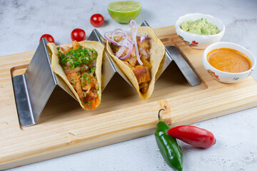 Traditional Mexican tacos, pork, cheese, pico de gallo, onion, served with guacamole and hot sauce