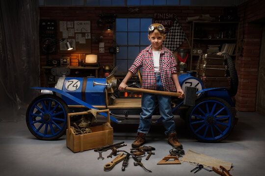 Little boys play in the garage and pretend they are mechanics. Children imagine themselves as racers in a retro car and dream of adventure and travel.