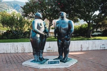 Embankment with sculptures in Monte Carlo in Monaco. Adam and Eva - obrazy, fototapety, plakaty