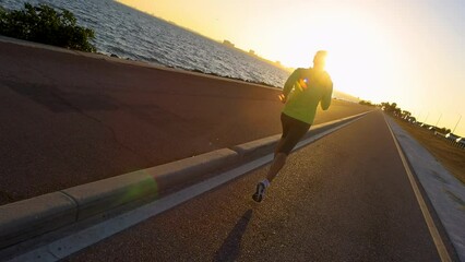 POV female jogging sunrise fitness Gulf coast 