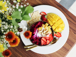 Smoothie bowl with mango, strawberry, dragon fruit