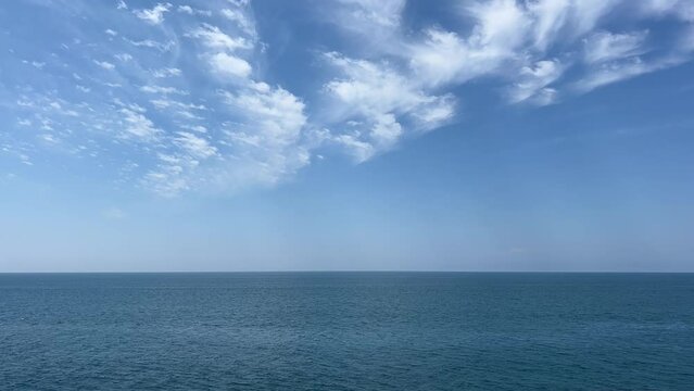 Blue sea, sky and beautiful clouds.