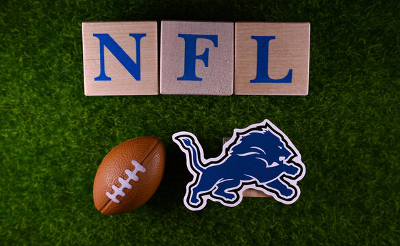 January 27, 2023, Canton, USA. The emblem of the Detroit Lions football club on the green lawn of the stadium.